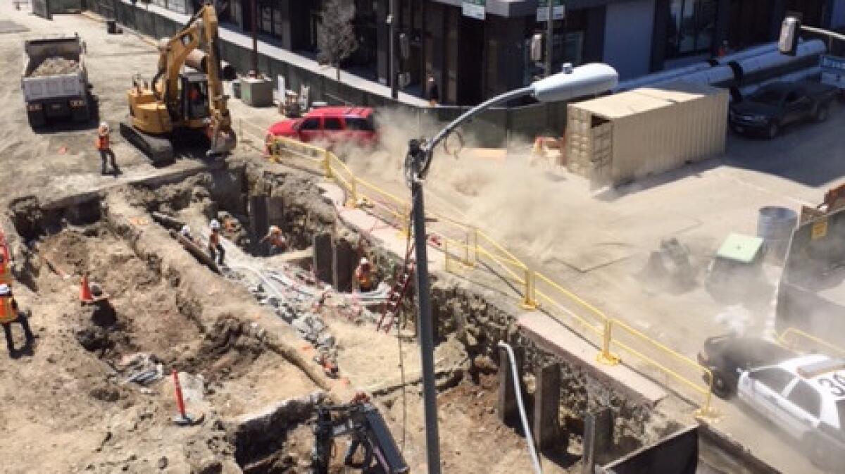 A car leads officers on a pursuit through a downtown L.A. construction site.