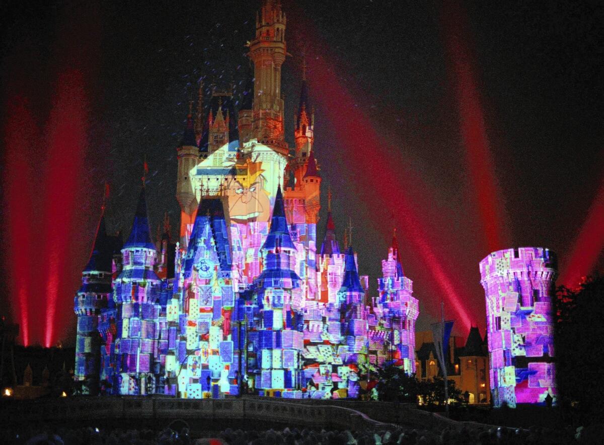 Images of Disney characters are projected onto the Cinderella castle at Tokyo Disneyland, which surpassed Disneyland Resort in Anaheim as the second-most-popular theme park in the world, behind Disney's Magic Kingdom in Florida.