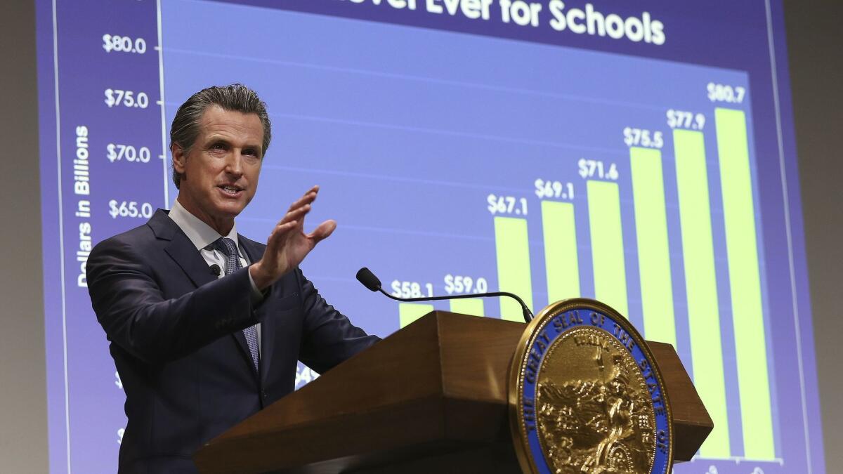 Gov. Gavin Newsom presents his first state budget during a news conference on Jan. 10. The governor's fiscal advisors reported on Tuesday that state revenues are currently $2.3 billion below expectations.