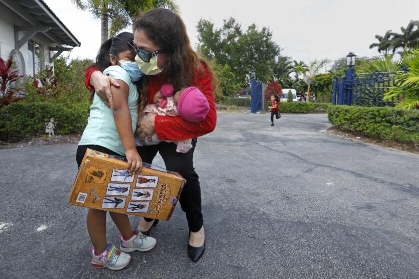 =Nicaraguan-American businesswoman Nora Sandigo welcomes migrant families to her home on the outskirts of Miami