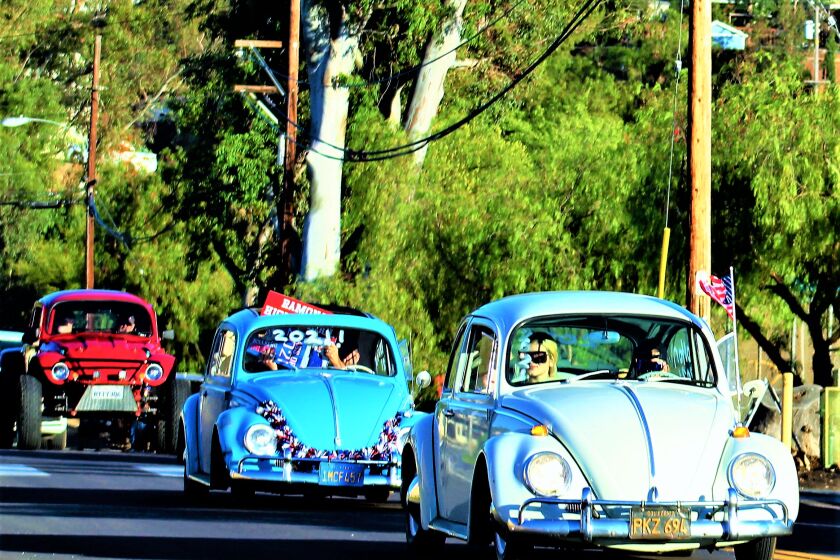 A convoy of VW Bugs celebrates the Class of 2021 at the Ramona American Graffiti Cruise Night on June 10.