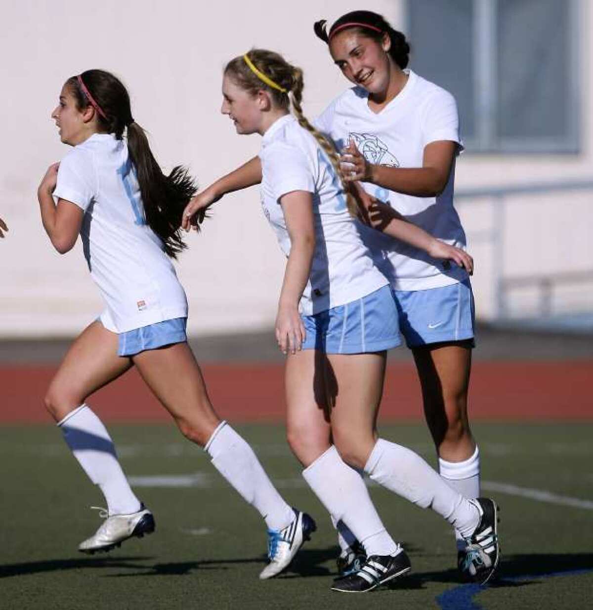 Crescenta Valley's Sierra Rhoads, center, is congratulated by teammates after scoring the match's only goal.