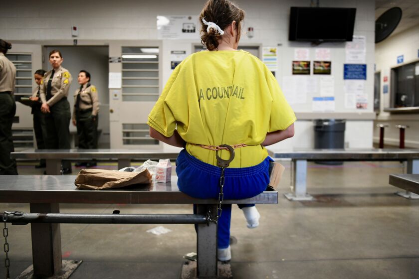 LOS ANGELES, CA-OCTOBER 2, 2017: An inmate sits inside Century Regional Detention Facility in Los Angeles on Monday, October 2, 2017. The jail, which houses female inmates, is where two alleged rapes by a male guard happened earlier this month. The alleged assaults came at a time when the Los Angeles County Sheriff's Department, which runs the jail, is trying to implement changes to ensure the sexual safety of inmates and become compliant with a federal mandate to eliminate prison rape. (Christina House / Los Angeles Times)