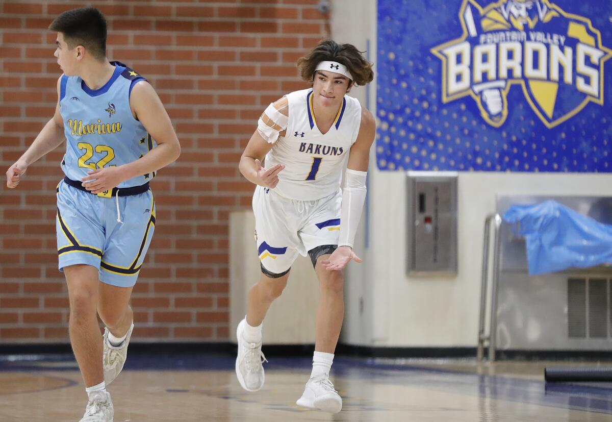 Fountain Valley's Aden Casarez (1) reacts after sinking a three-point basket on Friday night.