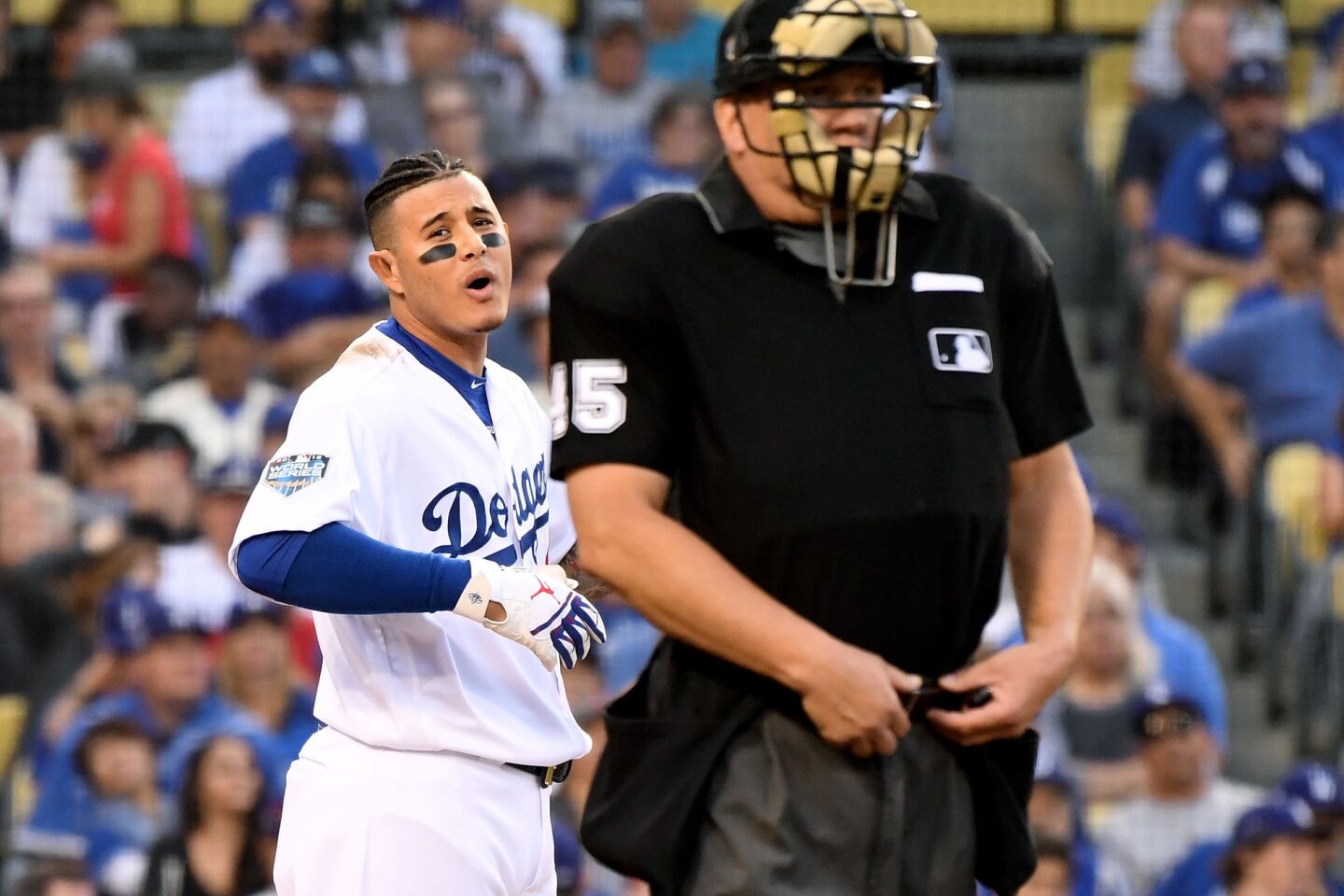 Ddogers Manny Machado complains to home plate umpire Jeff Nelson afgter striking out against the Red Sox in the 1st inning.