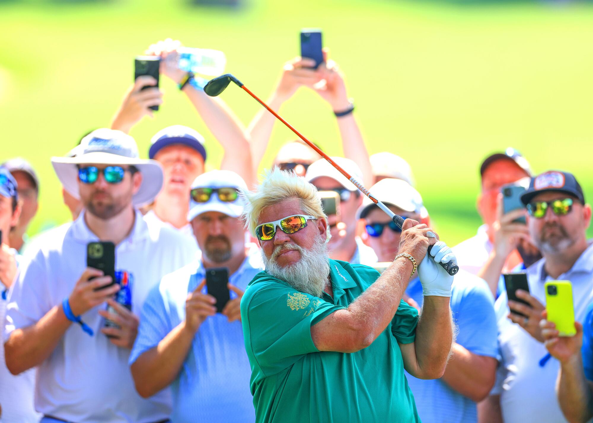 John Daly plays his second shot on the 16th hole during the first round of the 2022 PGA Championship at Southern Hills