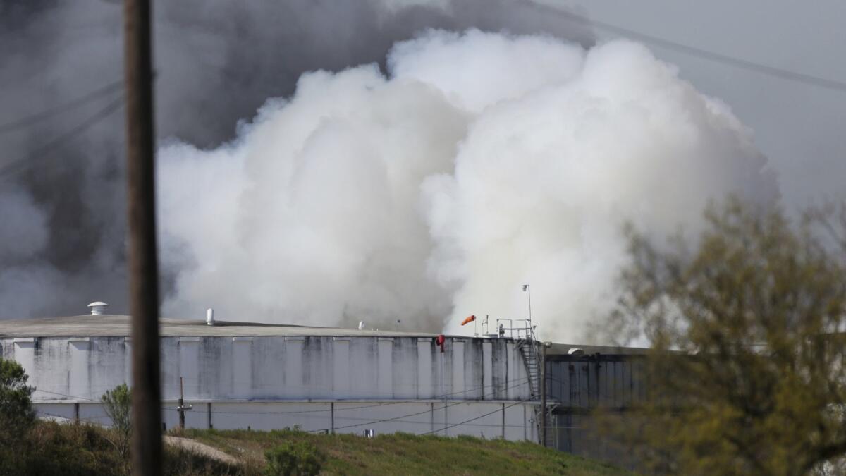 A petrochemical fire at Intercontinental Terminals Co. reignited as crews tried to clean out the chemicals that remained in the tanks on Friday in Deer Park, Texas.