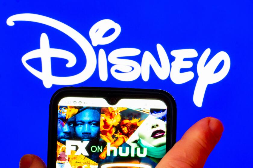 UKRAINE - 2022/02/03: In this photo illustration, the FX on Hulu logo is displayed on a smartphone screen with a Disney logo in the background. (Photo Illustration by Igor Golovniov/SOPA Images/LightRocket via Getty Images)