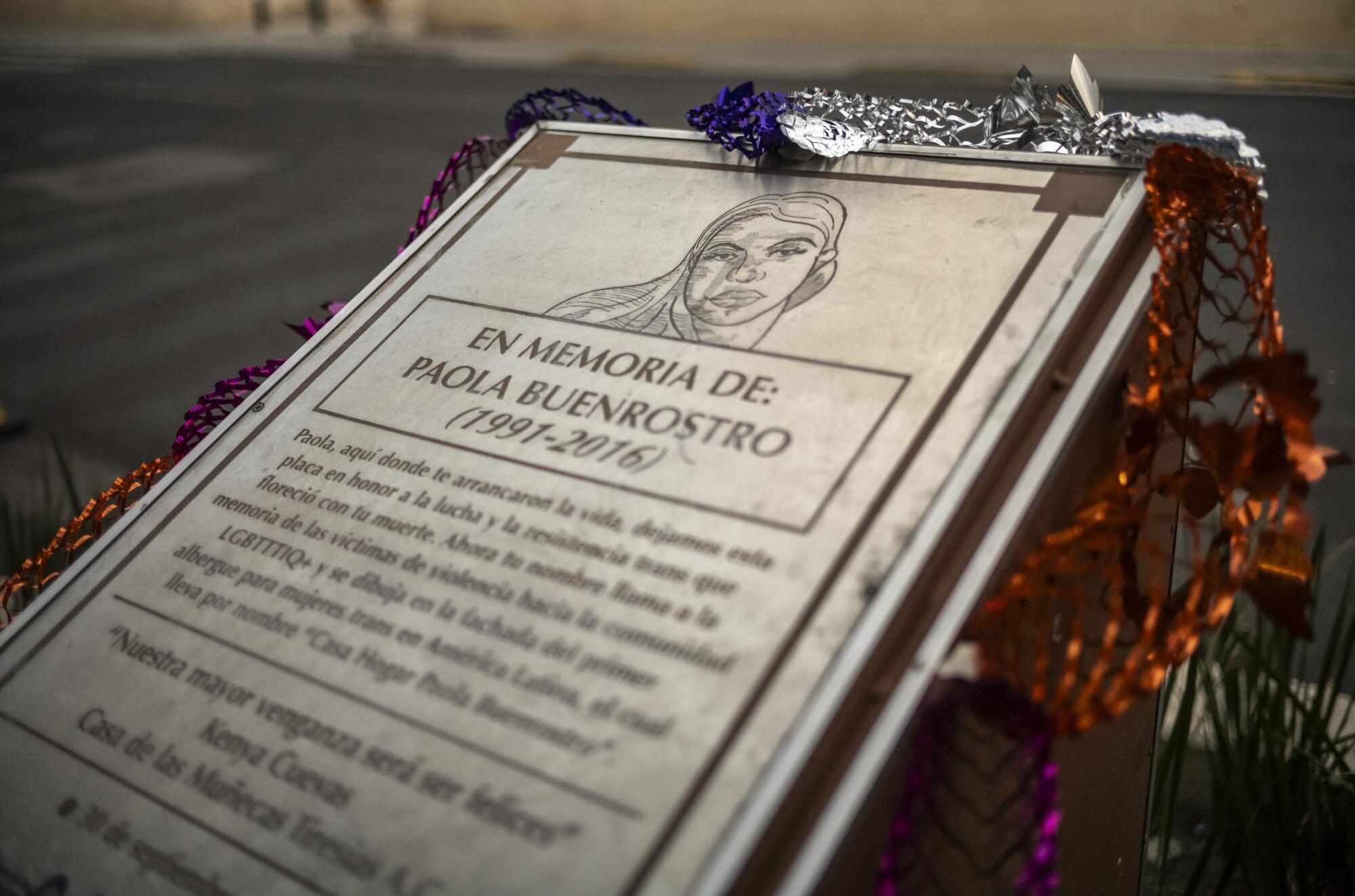 A commemorative plaque in memory of Paola Buenrostro