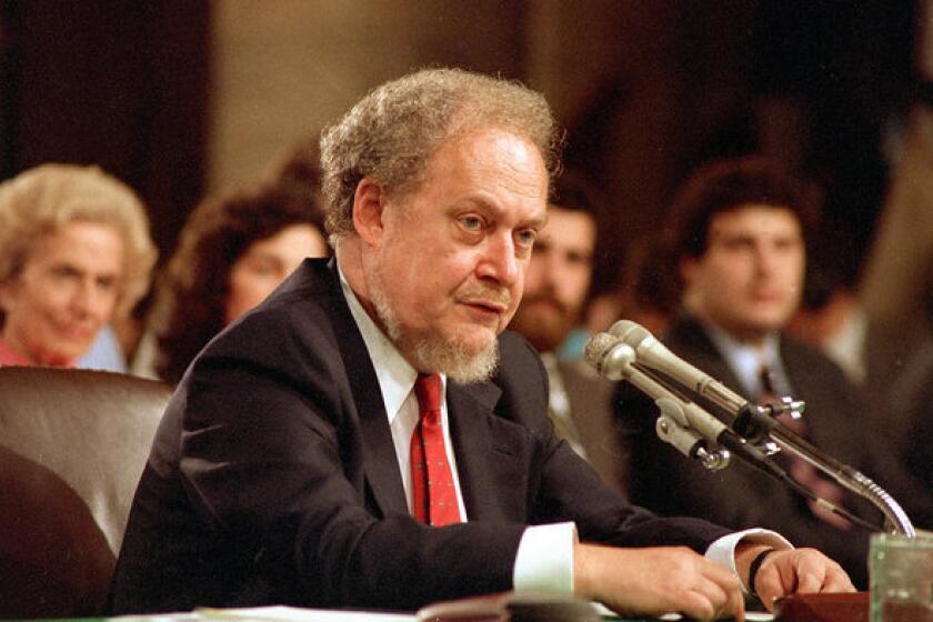 Robert Bork, shown at 1987 hearings on his nomination to the Supreme Court, died Wednesday.