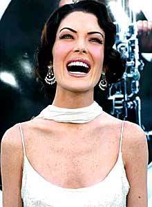 Lara Flynn Boyle smiles, we think, for photographers at the "Men in Black II" premiere.