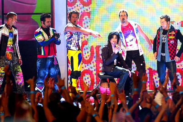 The 2001 VMAs sported many highlights, but Michael Jackson's return to the limelight stole the show. 'NSYNC just finished performing their lead single "Pop" off their third and final studio album, "Celebrity," when an outline of the "King of Pop" appeared on a giant Etch-A-Sketch. As the image lifted, Jackson walked out in his signature look and started performing his iconic dance movements while then-'NSYNC member Justin Timberlake beat-boxed in the background. Jackson's performance was to drum up anticipation for his latest album "Invincible," which was his first release of new music in over six years. Video: 'NSYNC bring out MJ at 2001 VMAs