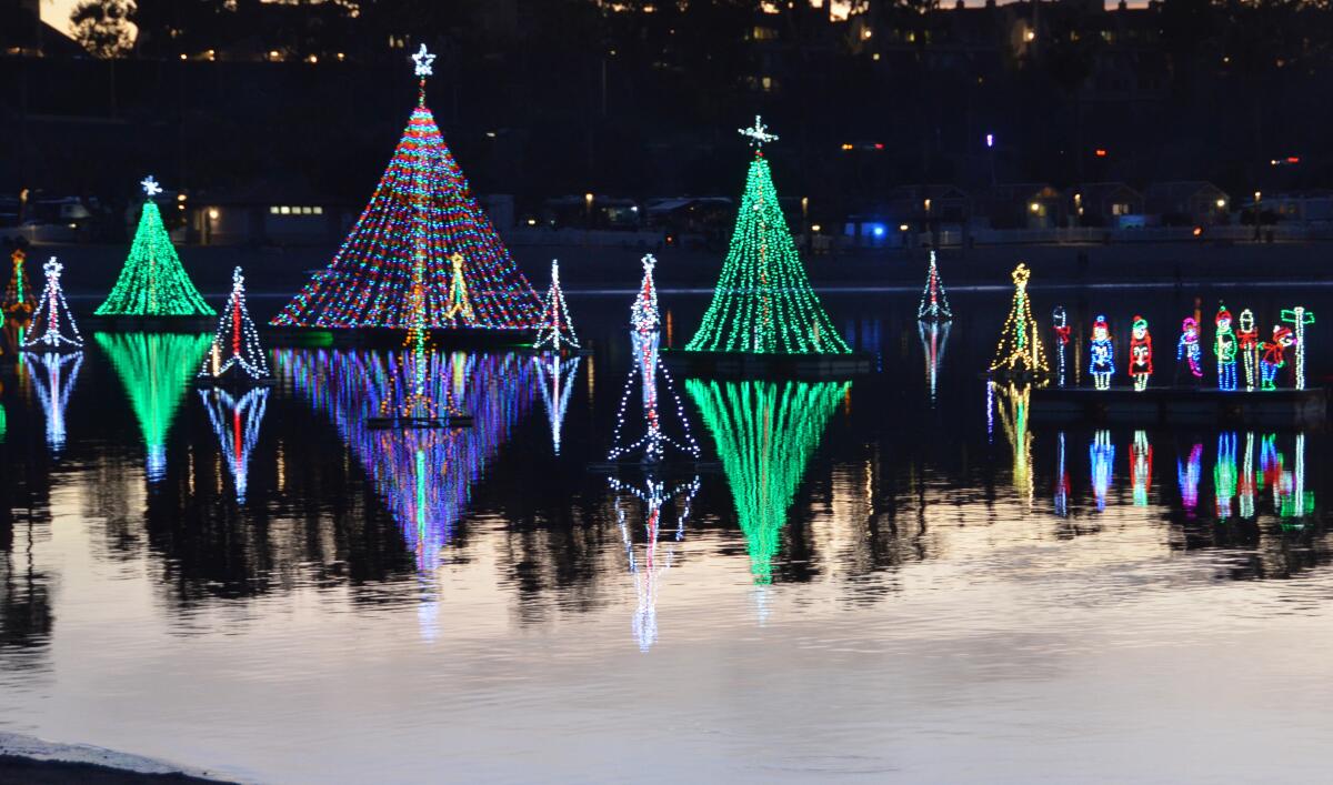 The Newport Dunes lagoon became a holiday light destination with the annual Lighting of the Bay on Friday.