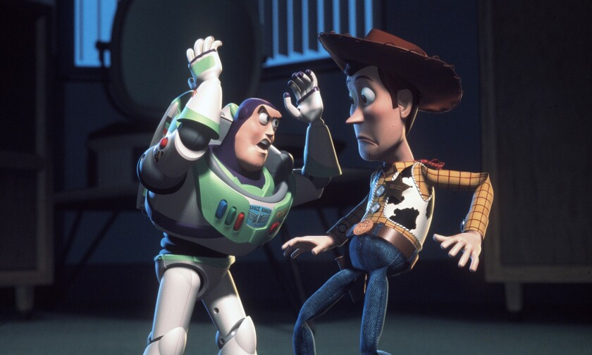 Buzz Lightyear (voice of Tim Allen), left, and Woody (voice of Tom Hanks) led the cast of toys in "Toy Story."