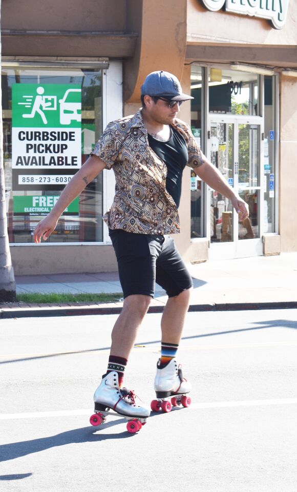 Sal Sanchez getting ready to spin on his roller skates.