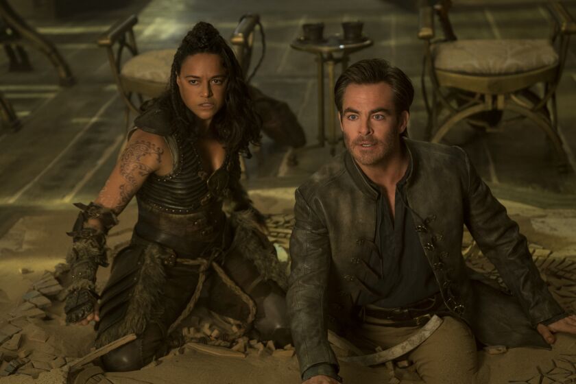 Chris Pine plays Edgin and Michelle Rodriguez plays Holga in 'Dungeons & Dragons: Honor Among Thieves.'