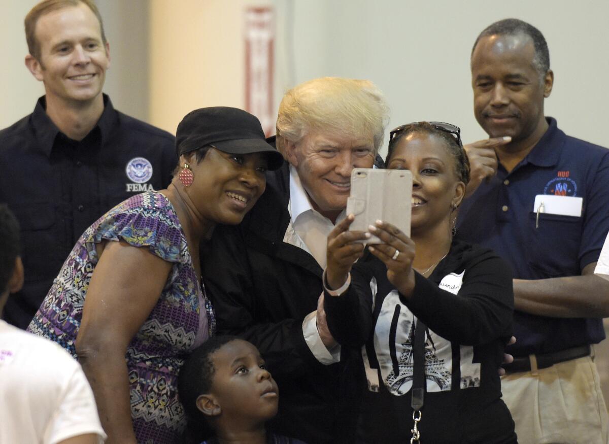 President Trump visits people impacted by Hurricane Harvey during a visit to the NRG Center in Houston on Sept. 2, 2017.