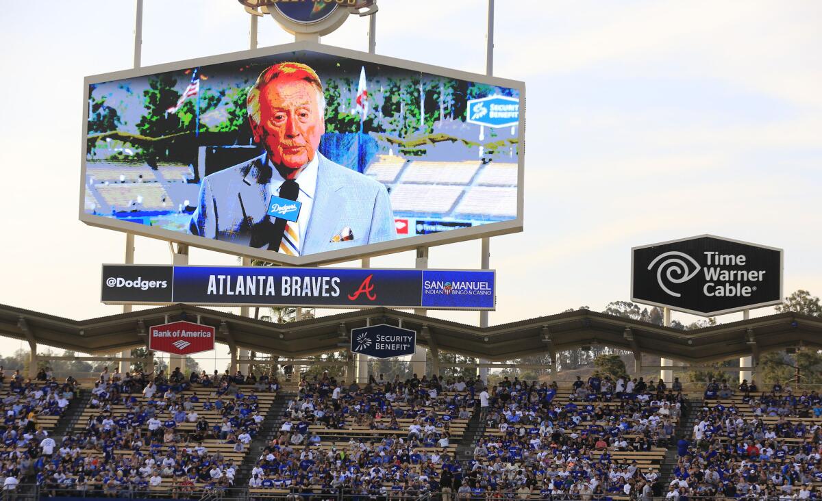 Vin Scully is shown on screen at Dodger Stadium in Los Angeles.