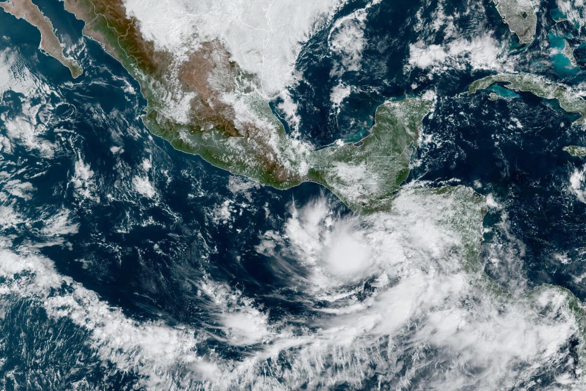 A satellite image shows Tropical Storm Pilar approaching El Salvador