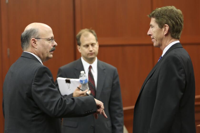 Assistant state attorney Bernie de la Rionda, left, taks to lead defense attorney Mark O'Mara during George Zimmerman's trial in Seminole circuit court in Sanford, Fla., Friday, June 21, 2013. Zimmerman has been charged with second-degree murder for the 2012 shooting death of Trayvon Martin. (Gary W. Green/Orlando Sentinel/Pool)