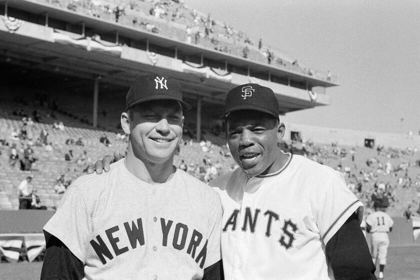 Mickey Mantle and Willie Mays, seen posing together here before the 1962 World Series, both were banned from baseball at one time.
