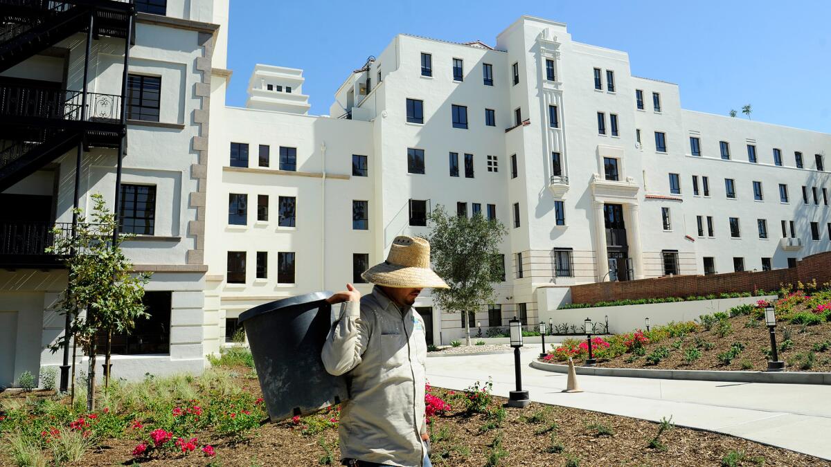 A gardener works in the yard at the former Linda Vista Hospital that is now affordable housing -- but where will new housing go?