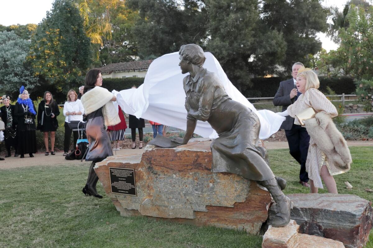 Sculptor Nina de Burgh and Jenny Freeborn unveil the Lilian Rice statue Oct. 23 in RSF's North Village Park.