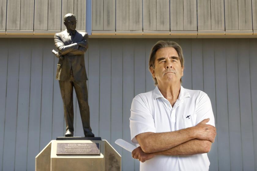 LOS ANGELES-CA-AUGUST 15, 2019: Beau Bridges is photographed with the John Wooden statue at UCLA on Thursday, August 15, 2019. (Christina House / Los Angeles Times)