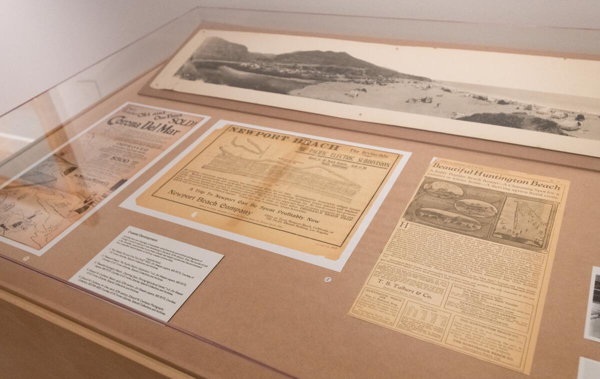 Antique ads for land development in coastal Orange County at the Langson Museum.
