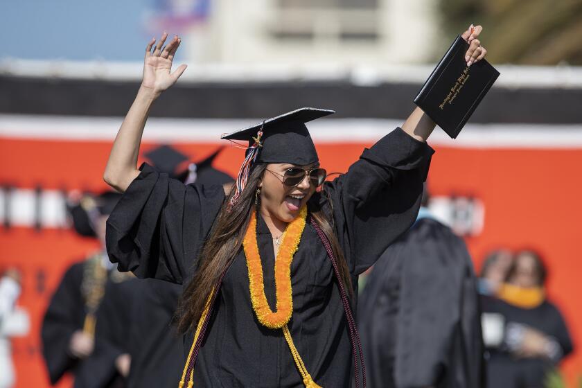 Kaylie Flowers celebrates during the 2019 commencement ceremony for Huntington Beach High School on Wednesday, June 12.