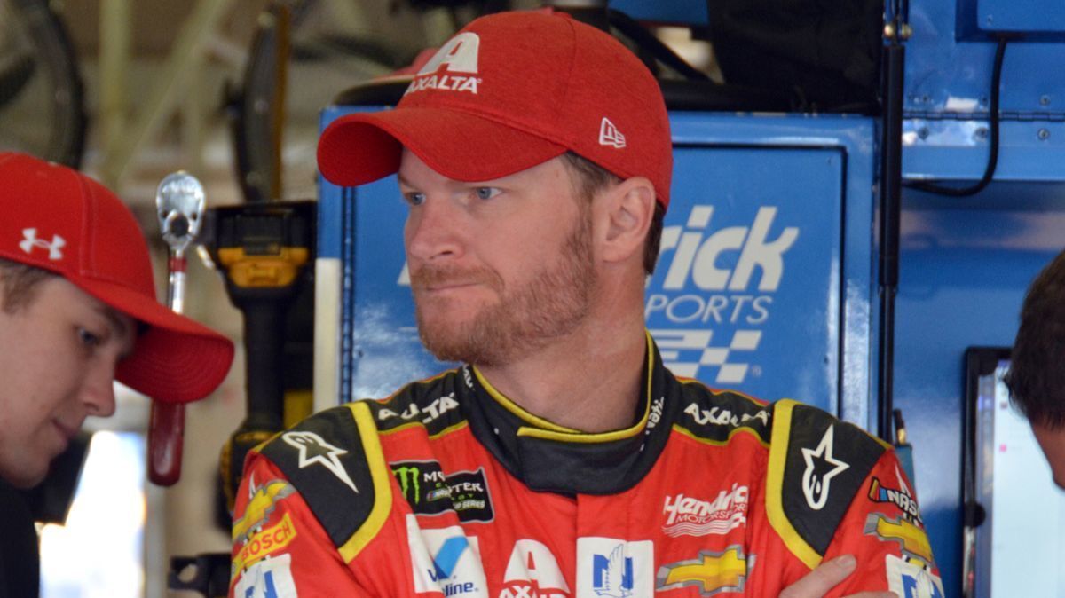 Dale Earnhardt Jr. stands in the garage during a practice for Sunday's NASCAR Cup Series auto race.