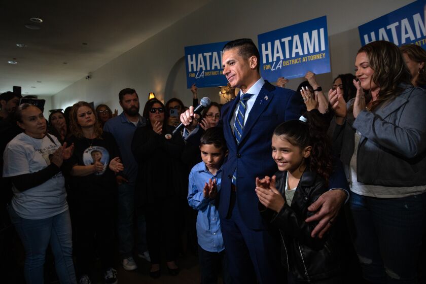 Whittier, CA - March 29: DDA Jonathan Hatami announces his bid to challenge L.A. D.A. George Gascon in the 2024 election cycle. at the Mission Square Restaurant on Wednesday, March 29, 2023, in Whittier, CA. He is standing next to his children Jon Jr., Lindsey Beth, and his wife Roxanne Hatami, right. (Francine Orr / Los Angeles Times)