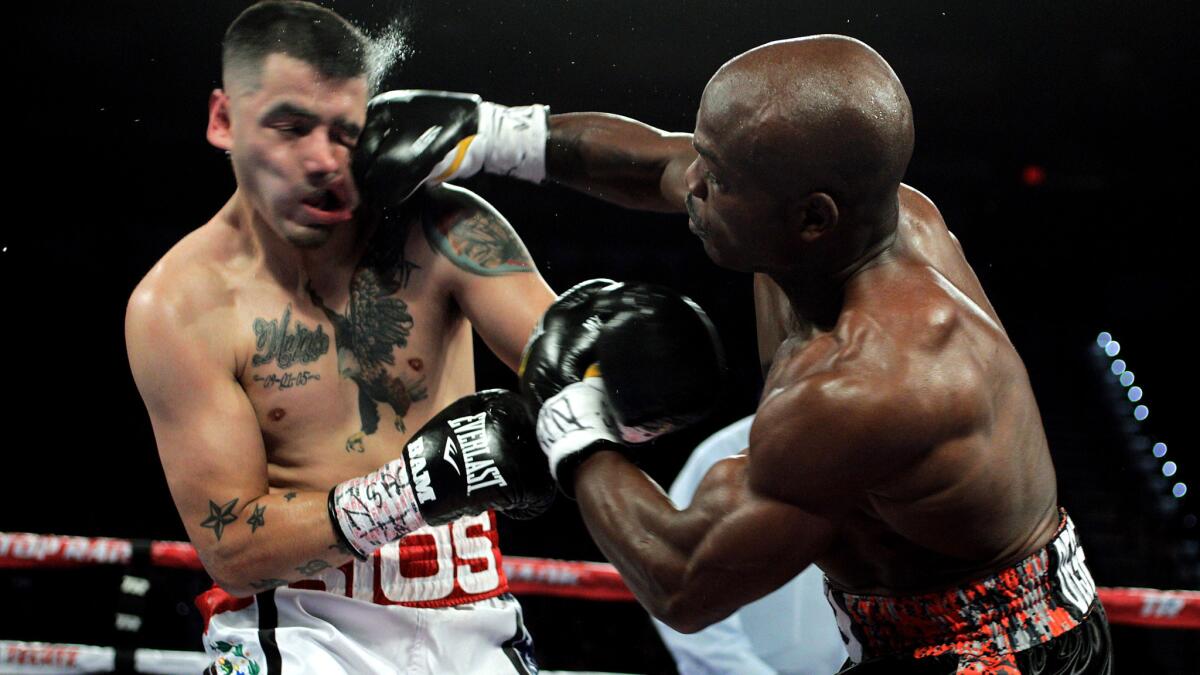 Timothy Bradley Jr. connects to Brandon Rios' face during their WBO welterweight championship bout on Saturday night in Las Vegas.