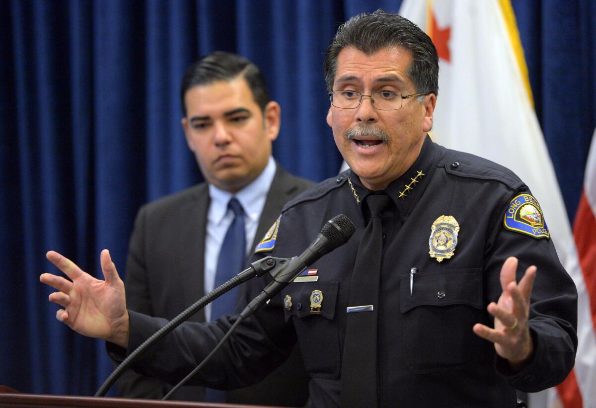 Flanked by Long Beach Mayor Robert Garcia, Police Chief Robert Luna pleads with the public for information regarding the death of 3-week-old Eliza Delacruz.