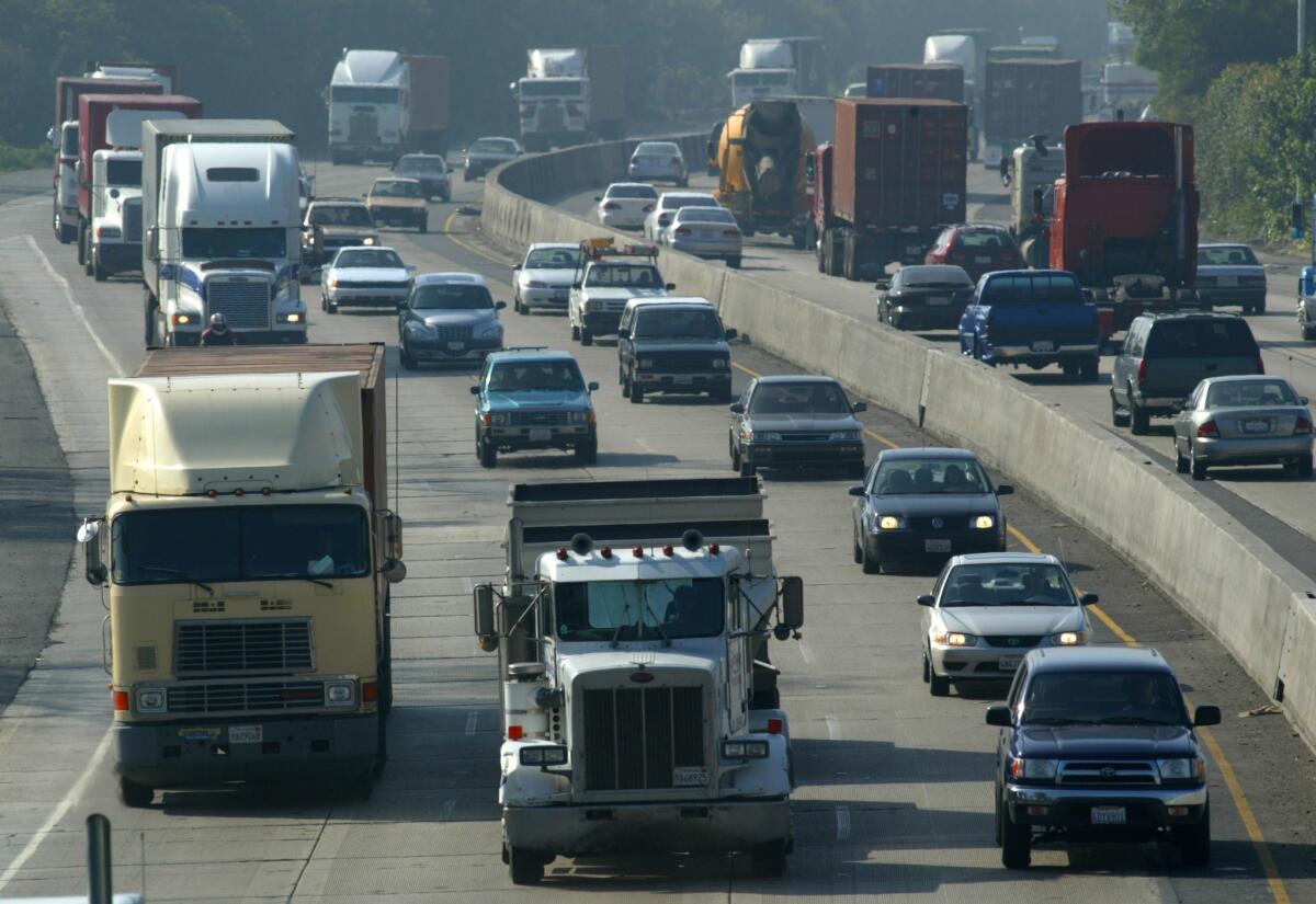 Trucks make their way out of the ports of Los Angeles and Long Beach on the 710 Freeway.