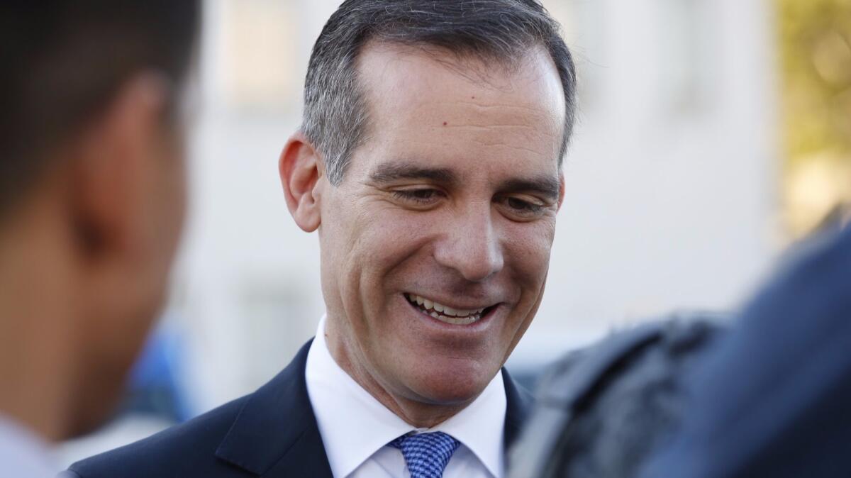 Los Angeles Mayor Eric Garcetti signed an executive directive Thursday to halt private, "ex parte" meetings between city planning commissioners and developers whose cases they are weighing.