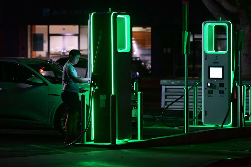 TOPSHOT - A driver charges his electric vehicle at a charging station as the California Independent System Operator announced a statewide electricity Flex Alert urging conservation to avoid blackouts in Monterey Park, California, on August 31, 2022 - Californians were told on August 31, 2022 not to charge their electric vehicles during peak hours, just days after the state said it would stop selling gasoline-powered cars, as the aging power grid battles a daunting heat wave.  Temperatures as high as 112 degrees Fahrenheit (44 degrees Celsius) were forecast in some Los Angeles suburbs as a massive heat dome bakes a swath of the western United States.  (Photo by Frederic J. BROWN/AFP) (Photo by FREDERIC J. BROWN/AFP via Getty Images)