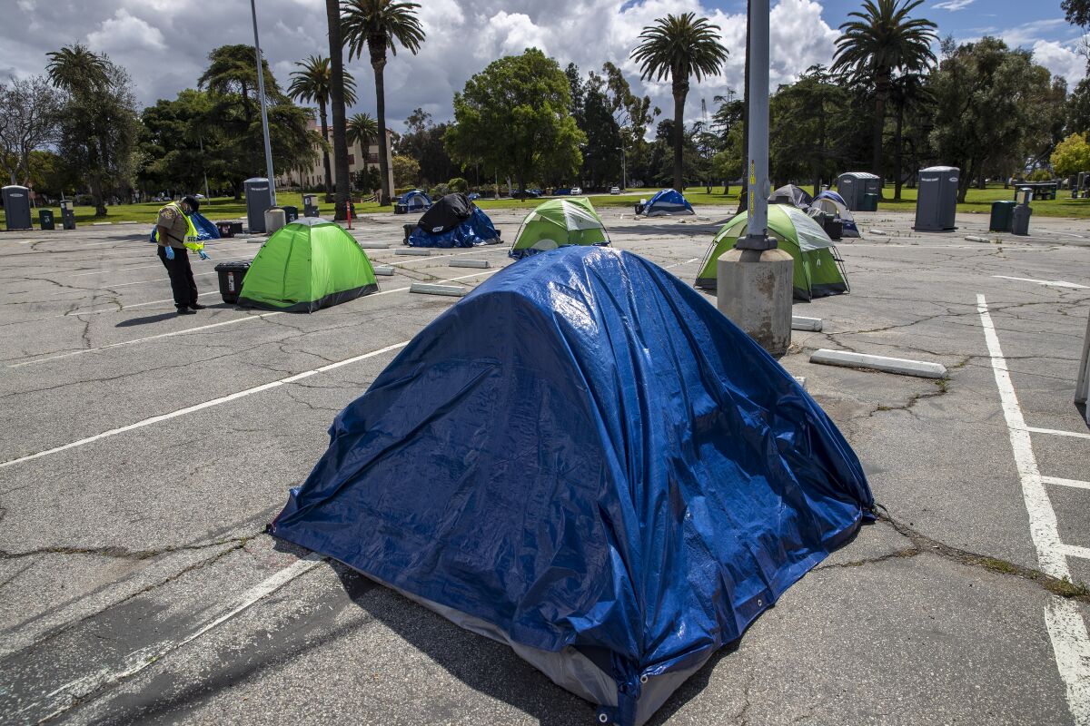 Homeless veterans set up camp in a VA parking lot in Los Angeles on April 8.