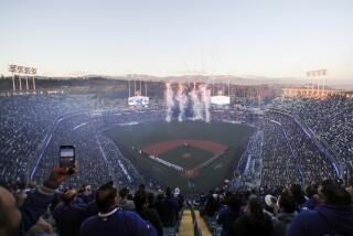 LOS ANGELES, CA - MARCH 30: Fireworks fly in the outfield of Dodger Stadium to commemorate the start.