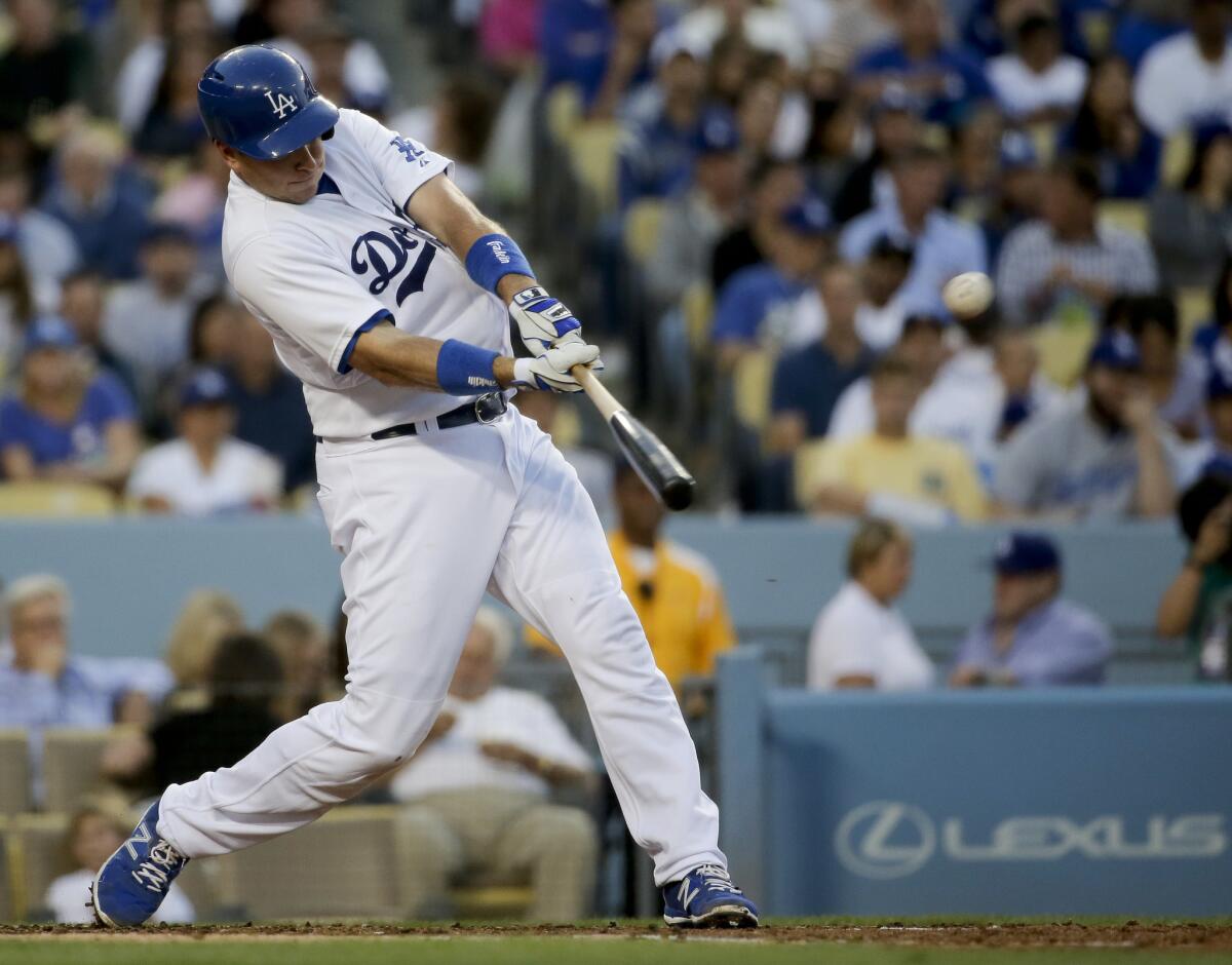 Dodgers catcher A.J. Ellis hits a two-run home run against the Phillies on Wednesday.