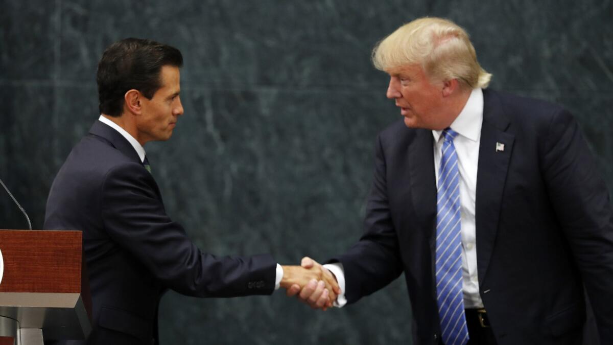 Mexican President Enrique Peña Nieto and Republican presidential nominee Donald Trump shake hands after a joint statement at Los Pinos, the official presidential residence, in Mexico City on Aug. 31, 2016.
