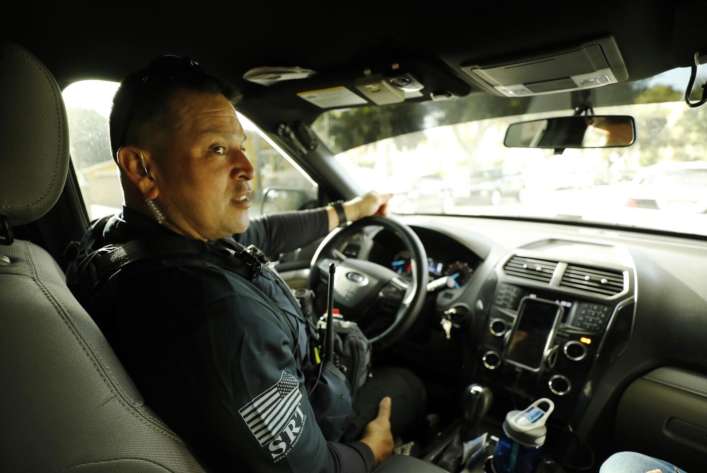 A law enforcement officer at the wheel