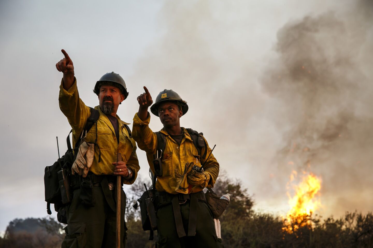 Firefighters assess the burn-out operation in El Capitan Canyon.