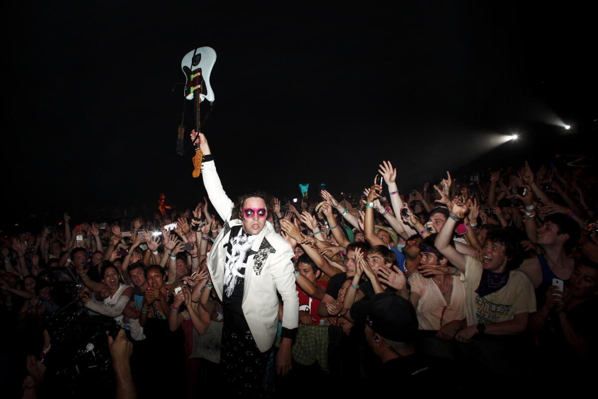 Win Butler, lead singer of Arcade Fire, closes out this year's edition of Coachella on April 20, 2014. The band is on the bill to perform at the inaugural iHeartRadio Music Awards on May 1.