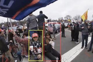 In a photo presented in a criminal complaint, two individuals subsequently identified as Kennedy Lindsey (yellow) and Danielle Lacy (red) traveled from Southern California to Washington D.C. and attended the "Stop the Steal Rally" at the Ellipse on January 6, 2021.