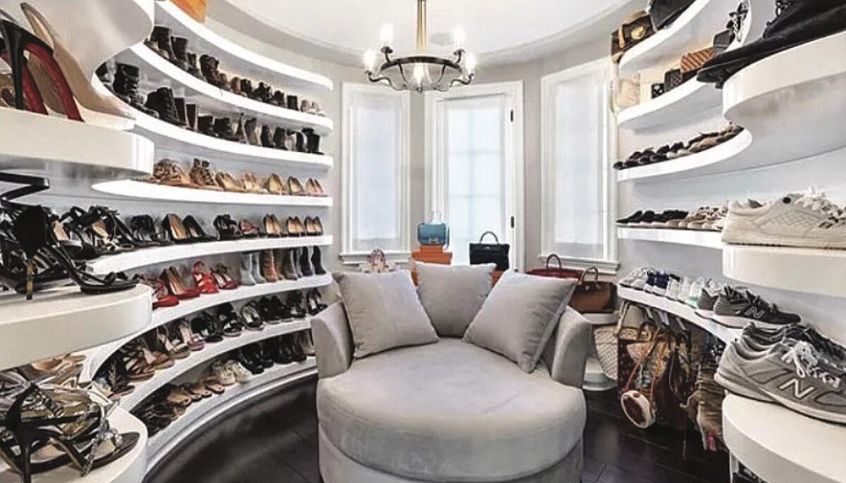 Some 50 pairs of high-end shoes in a closet. 