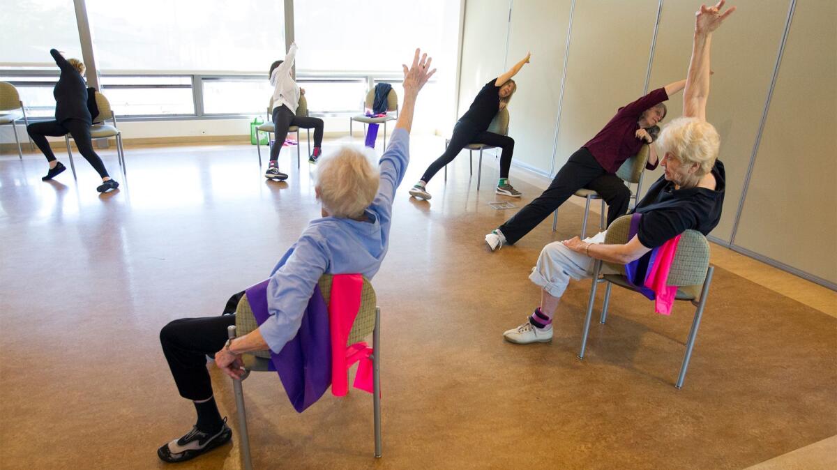 Kathryn Rollins teaches a chair standing class featuring strengthening and stretching exercises intended to promote bone health.