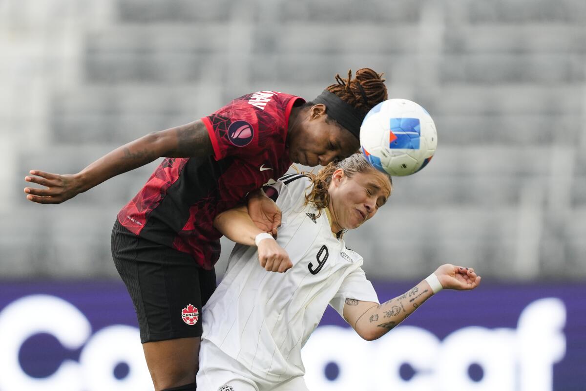 Canada defender Kadeisha Buchanan, left, and Costa Rica forward Maria Paula Salas.