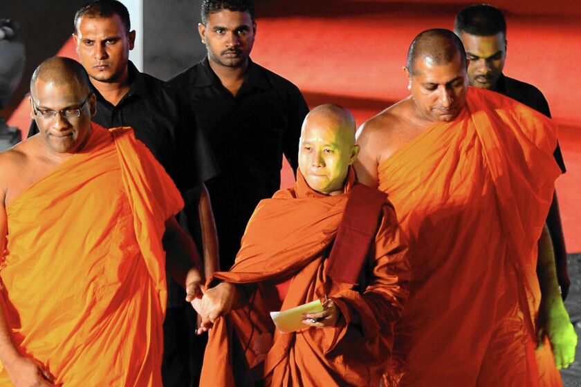 "Most Muslims destroy our country, our people and the Buddhist religion," says Buddhist monk Wirathu, center, of Myanmar, seen in 2014.