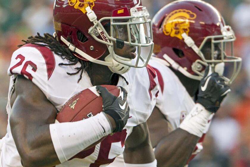 USC cornerback Josh Shaw was suspended indefinitely by Coach Steve Sarkisian after he admitted to fabricating a story about saving his nephew to cover up an injury to both of his ankles.